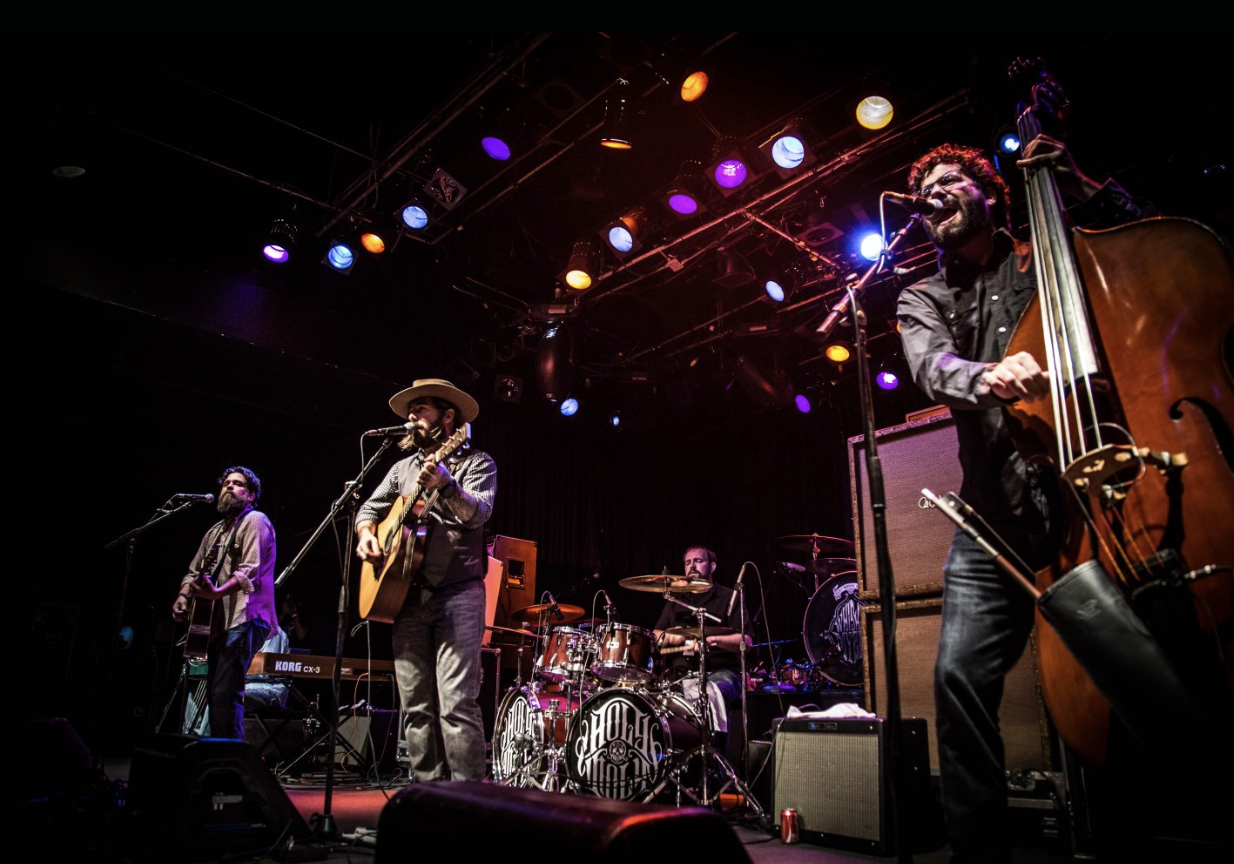 A live band playing on stage.