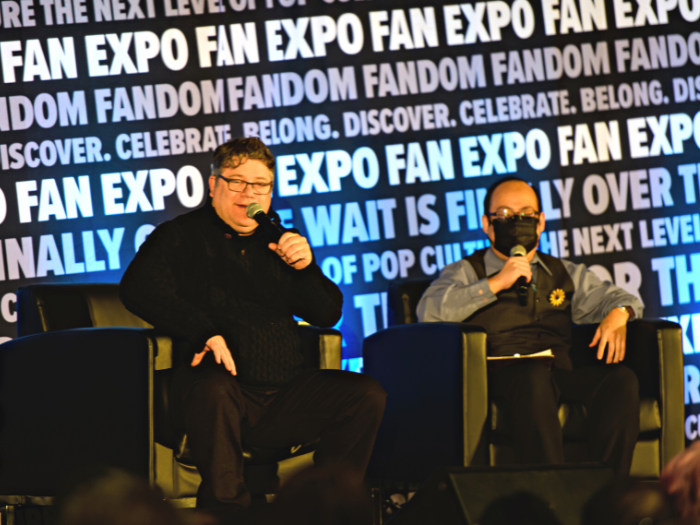 Sean Astin with a moderator at his panel at FAN EXPO Vancouver