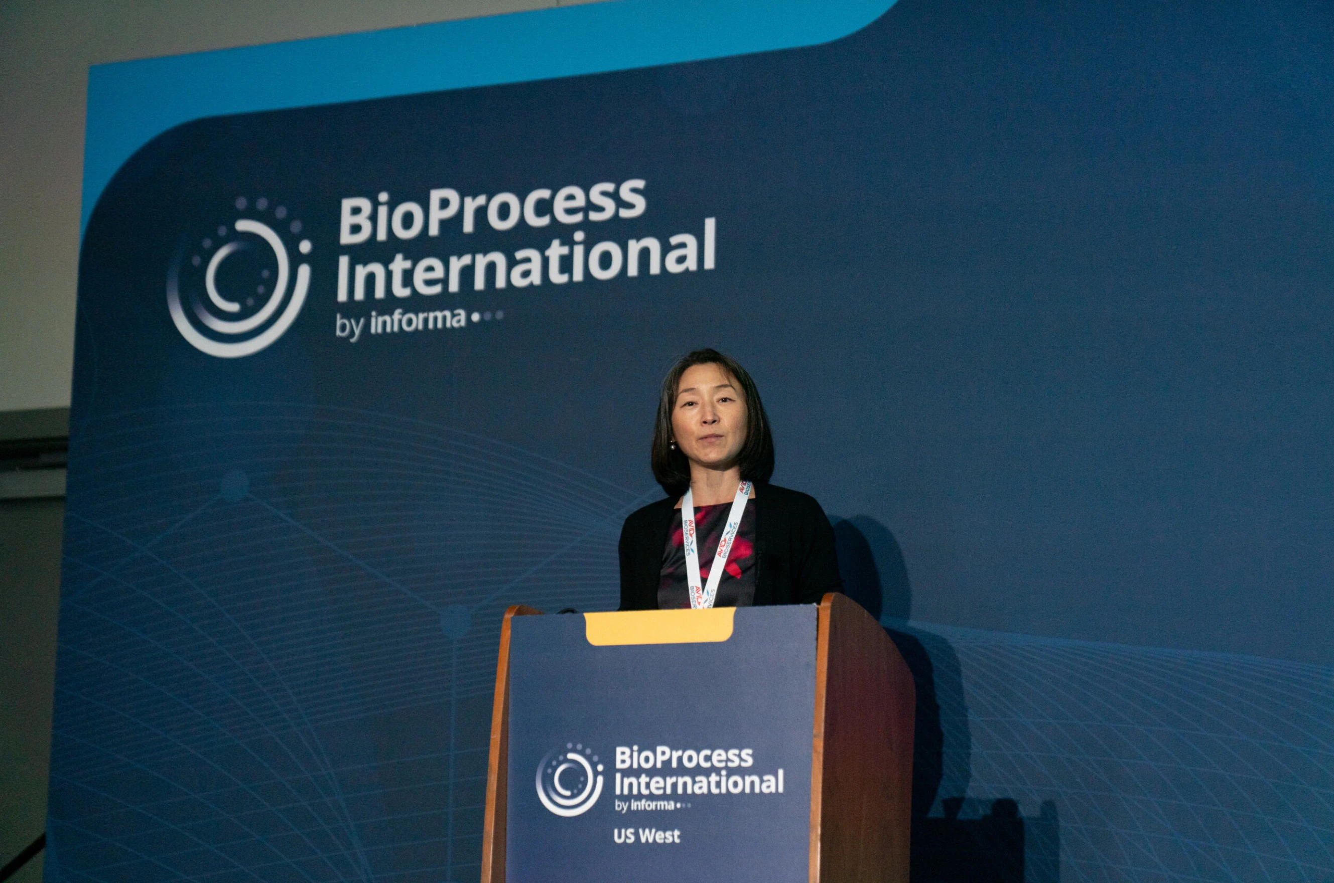 Panellists on stage listening to an audience member ask a question at BPI West in San Diego