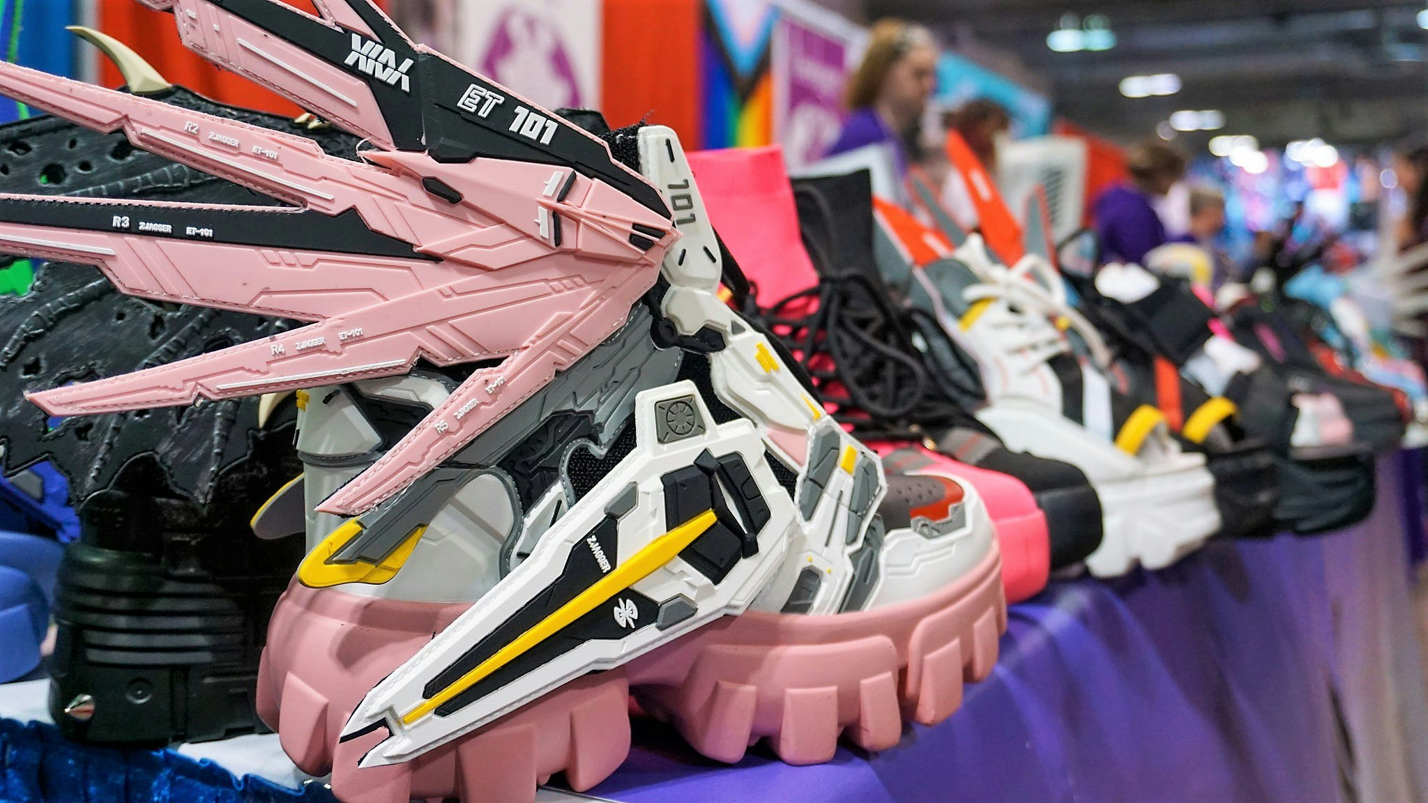 An anime themed sneaker sits on a vendor's table