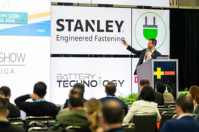 Tradeshow attendee looking at a product being showcased at the show