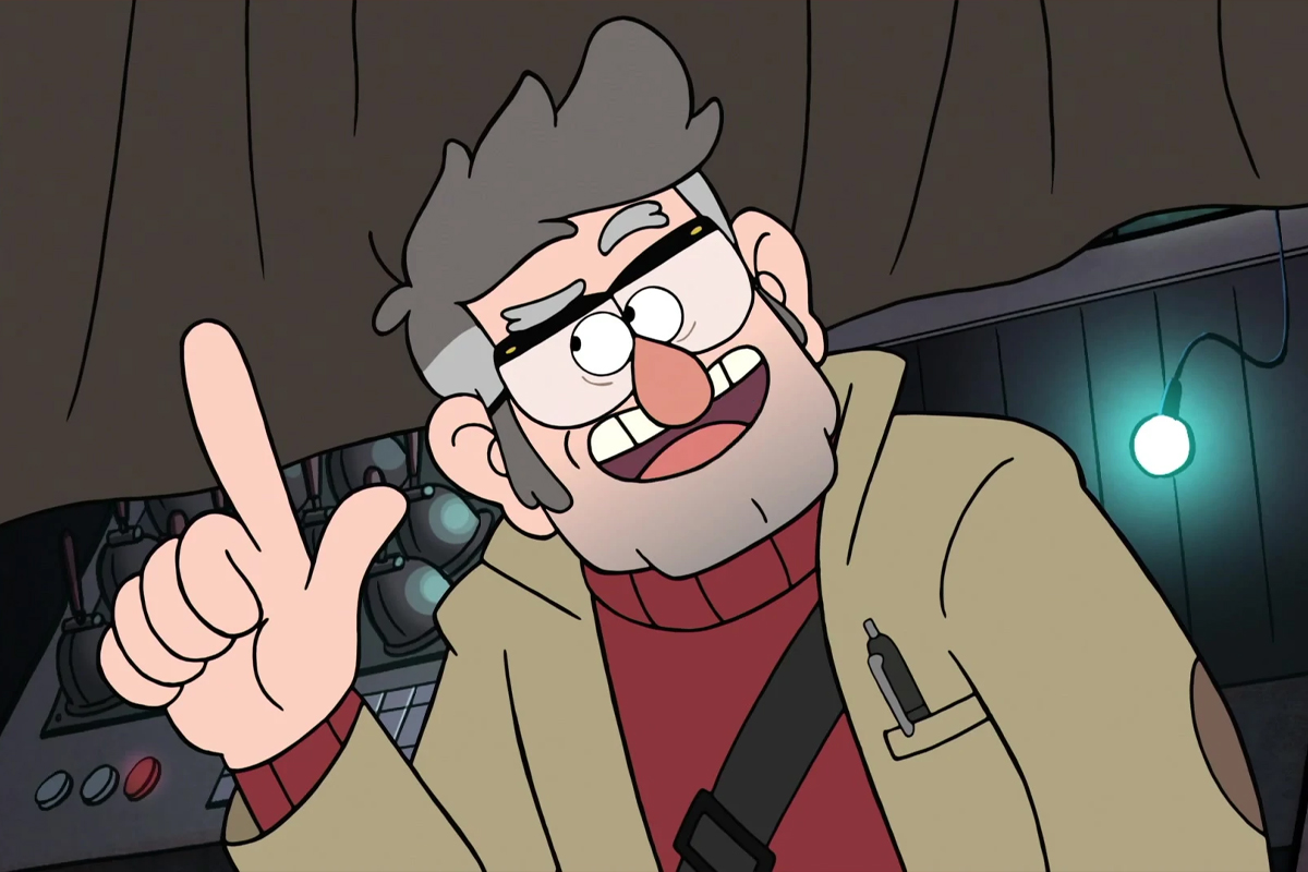 Stanford Pines smiling as he holds one finger in the air and looks to his right