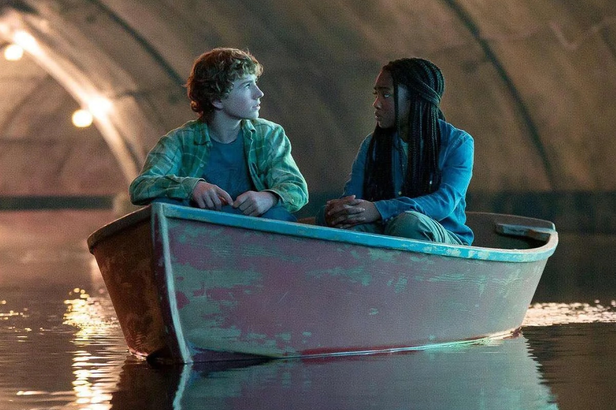 Percy and Annabeth sit together in a boat