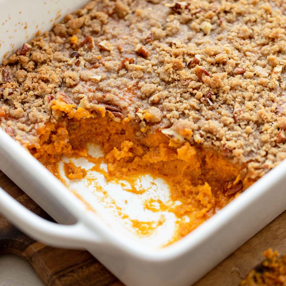 Sweet potato casserole in a white baking pan