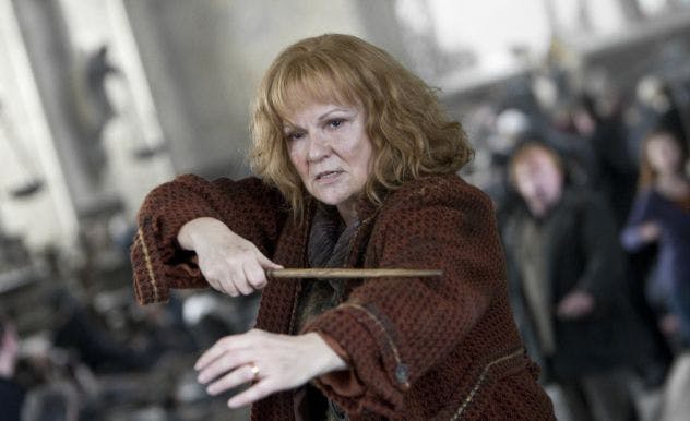 Molly Weasley from Harry Potter holding her wand defensively