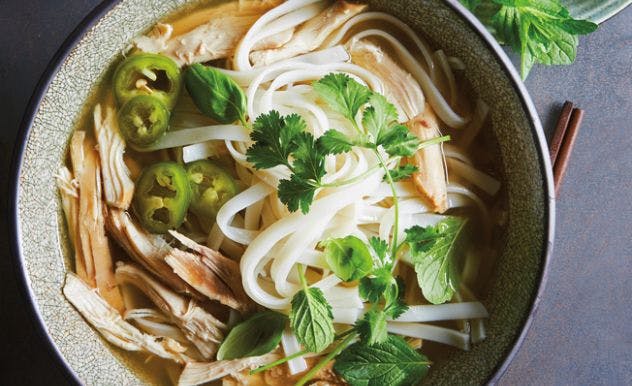 Ramen noodles in a bowl on a blue table