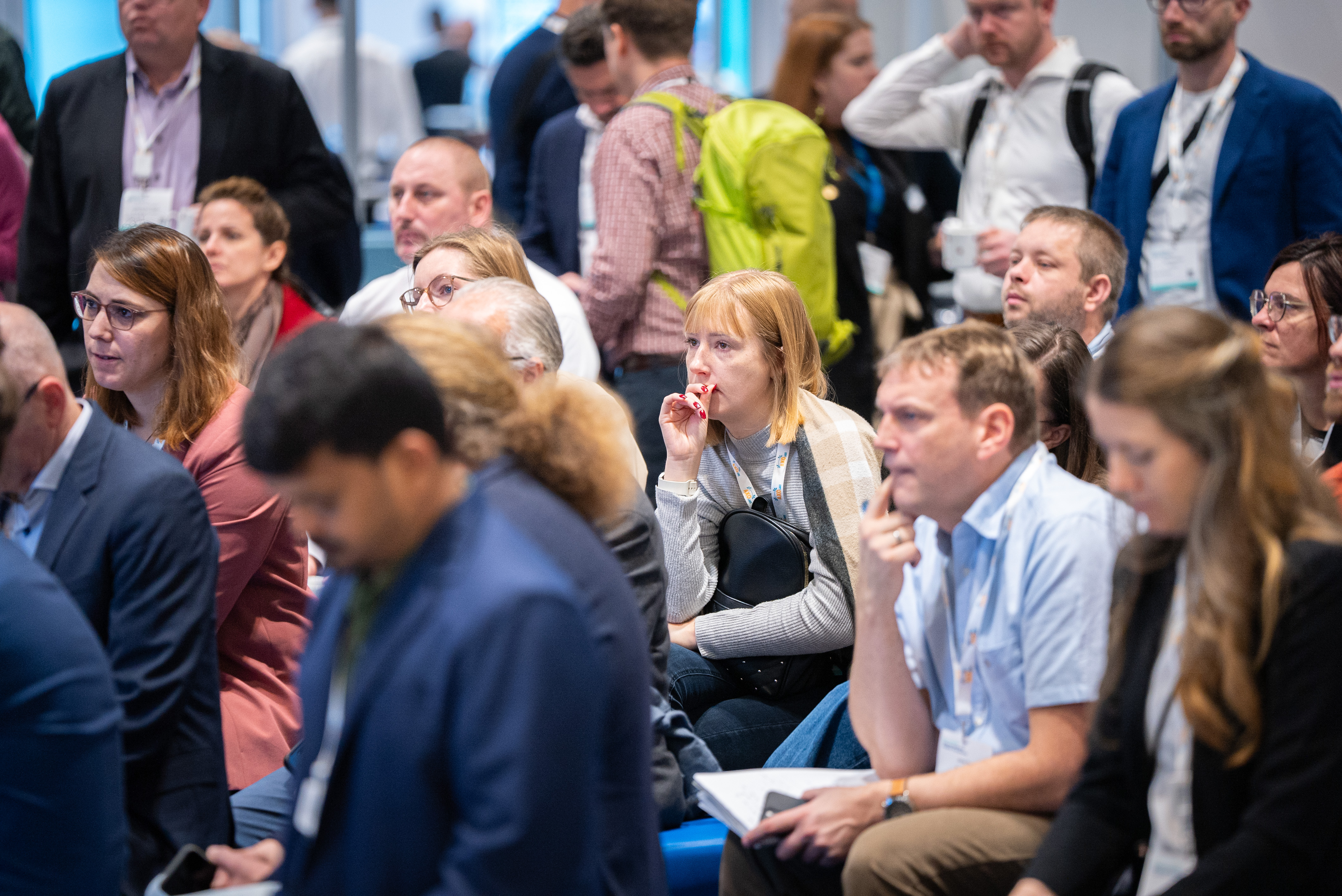 Close up picture of TIDES attendees sitting engrossed during a presentation