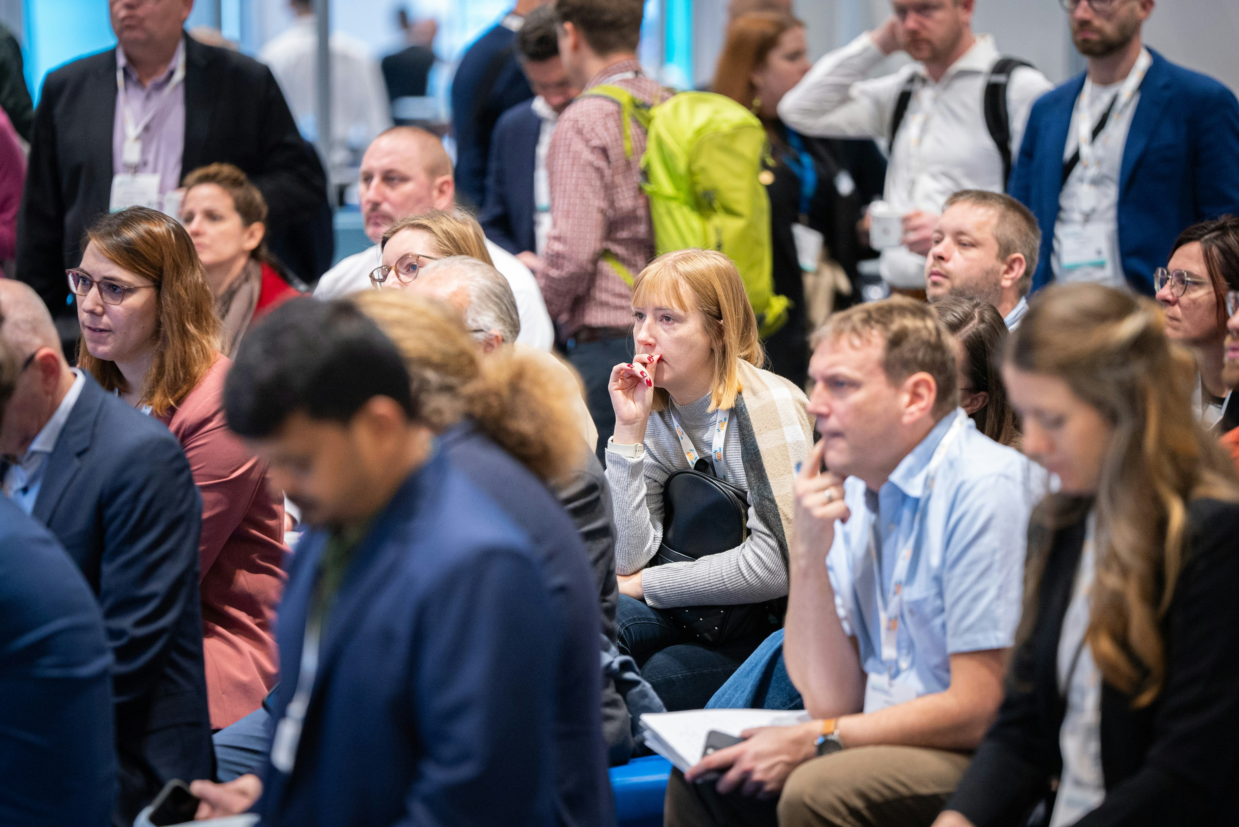 Close up picture of TIDES attendees sitting engrossed during a presentation