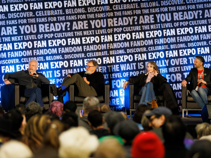 Brent Spiner, Jonathan Frakes, and Gates McFadden with a moderator at their panel at FAN EXPO Vancouver