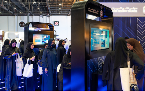 Emirati men and women performing tests on ipad at Tawdheef