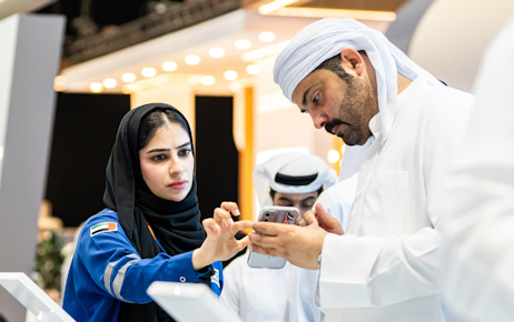 Emirati men and women exploring MOI stall in Tawdheef center