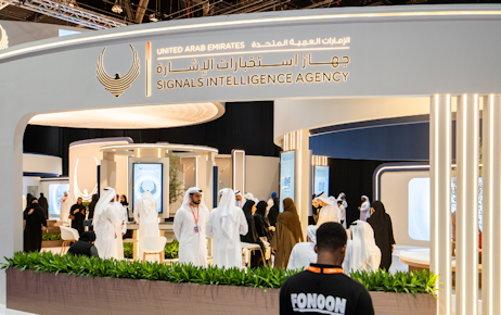 Female exhibitors discussing with Emirati men at Tawdheef