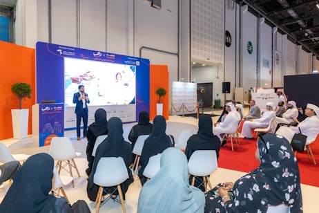 Emirati attendees listening to a live career workshop at Tawdheef x Zaheb 2025 in Abu Dhabi.