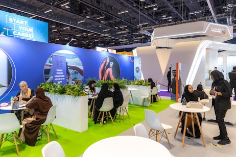 Emirati professionals networking and exchanging ideas at Tawdheef x Zaheb 2025 career expo.