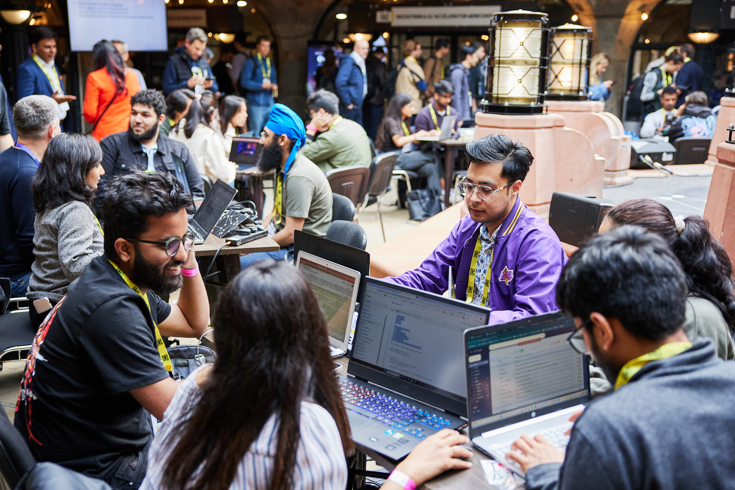 Teams at The AI Summit London work on a challenge