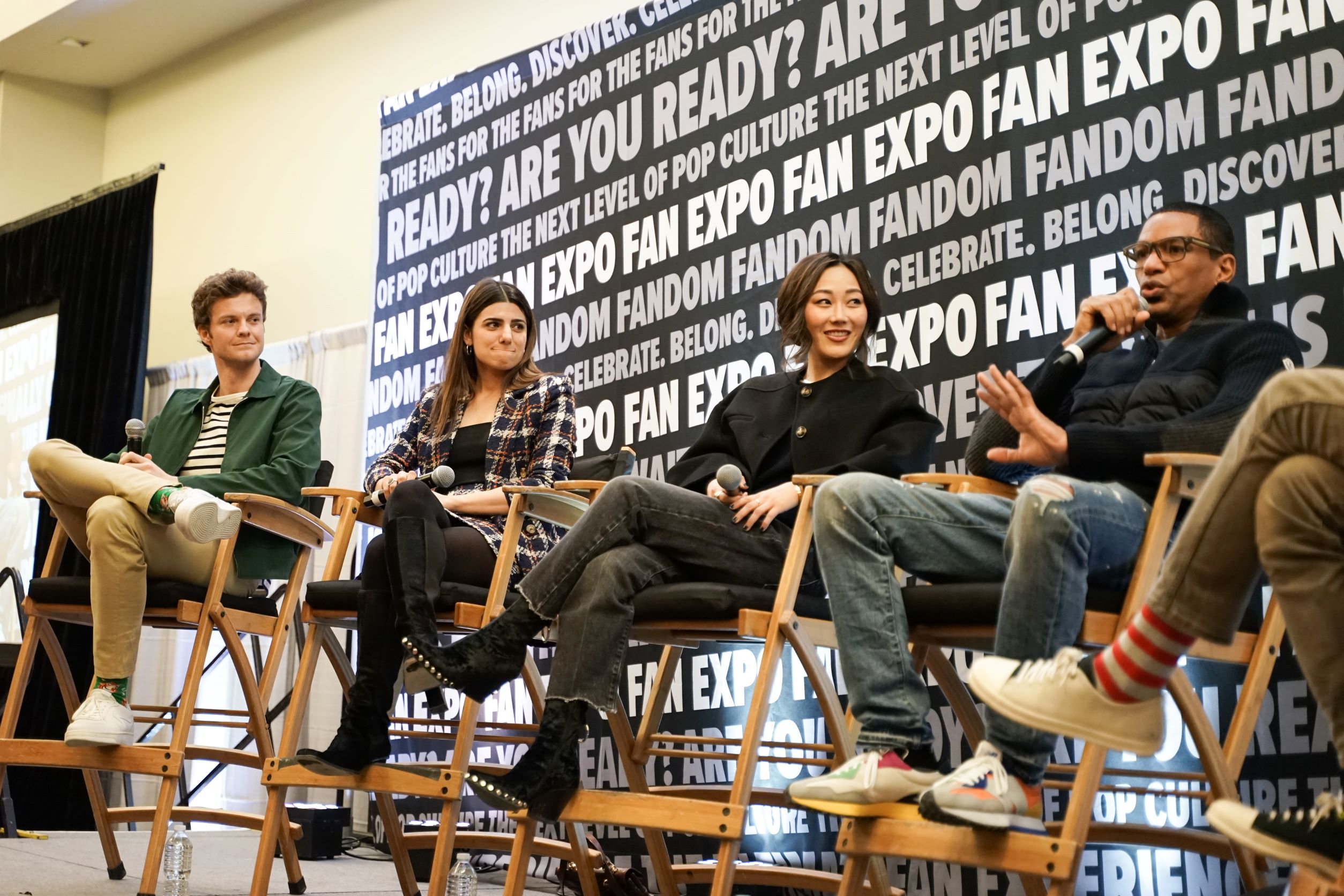 Jack Quaid, Claudia Doumit, Karen Fukuhara, Laz Alonso sit on-stage at Toronto Comicon for their panel.