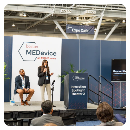 Two speakers on stage at Innovation Spotlight Theater