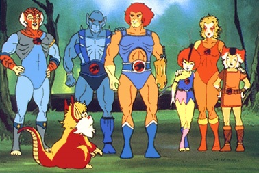 The main cast of He-Man stand side by side and look at a small furry creature infront of them