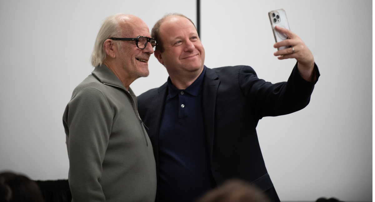 Colorado Governor Jared Polis snaps a selfie with Back to the Future star Christopher Lloyd