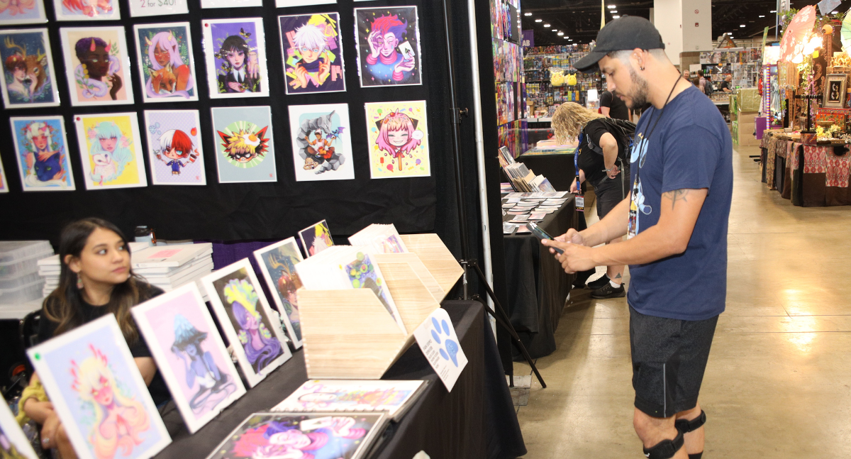 Fans interaction with our Blues Clues Scavenger Hunt before the show floor gets busy! He scans the QR code for his next clue.