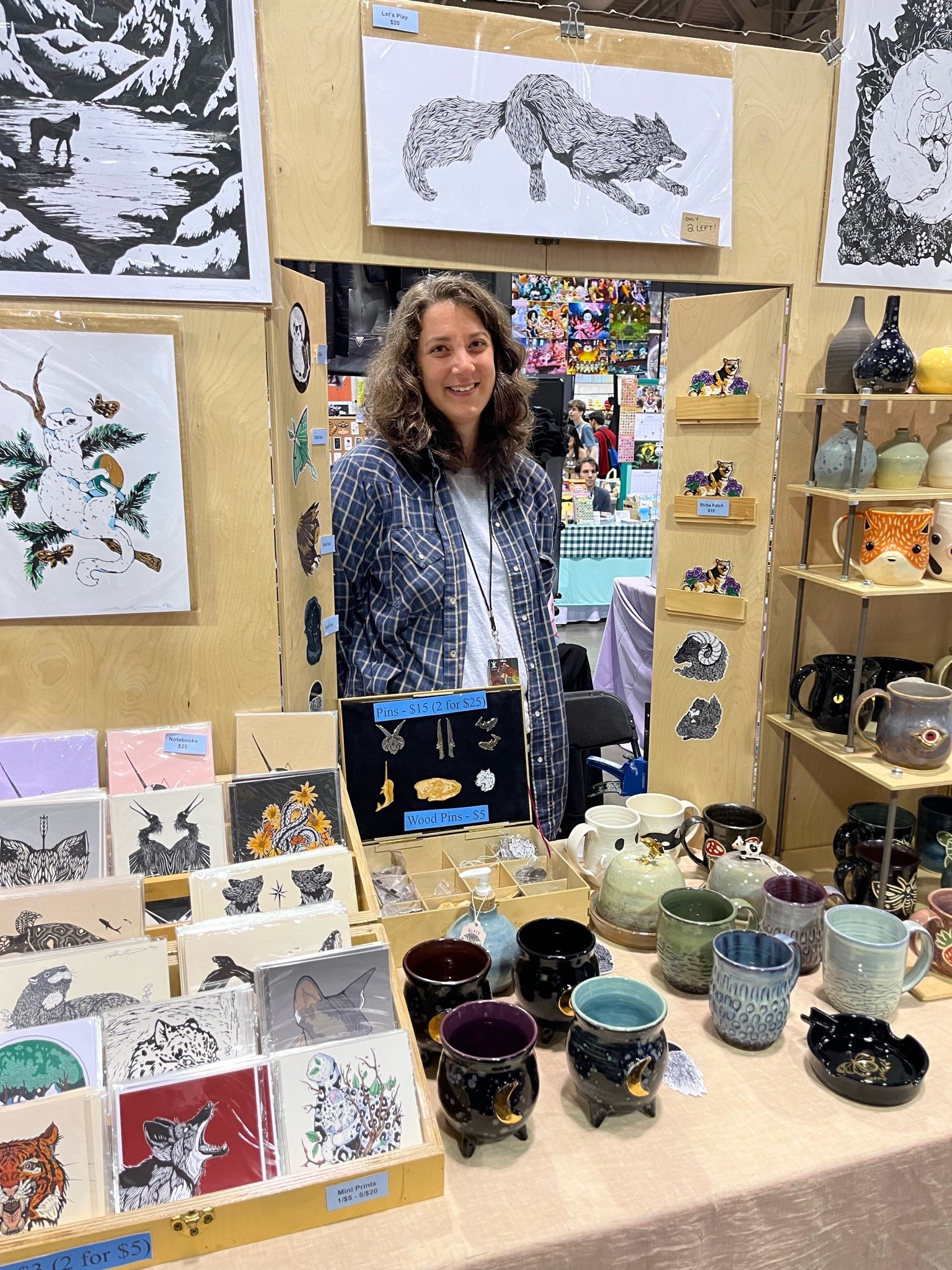 VENDOR POSES AT BOOTH