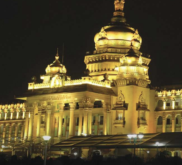 Building illuminated at night with exterior lights highlighting its architecture