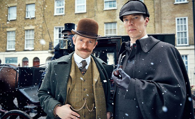 Sherlock and Watson stand in front of their carriage car in the snow.