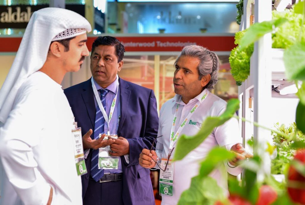 Exhibitors showcasing aquaculture and water management technologies at AgraME 2025 in Dubai, featuring systems for fish and shrimp farming.