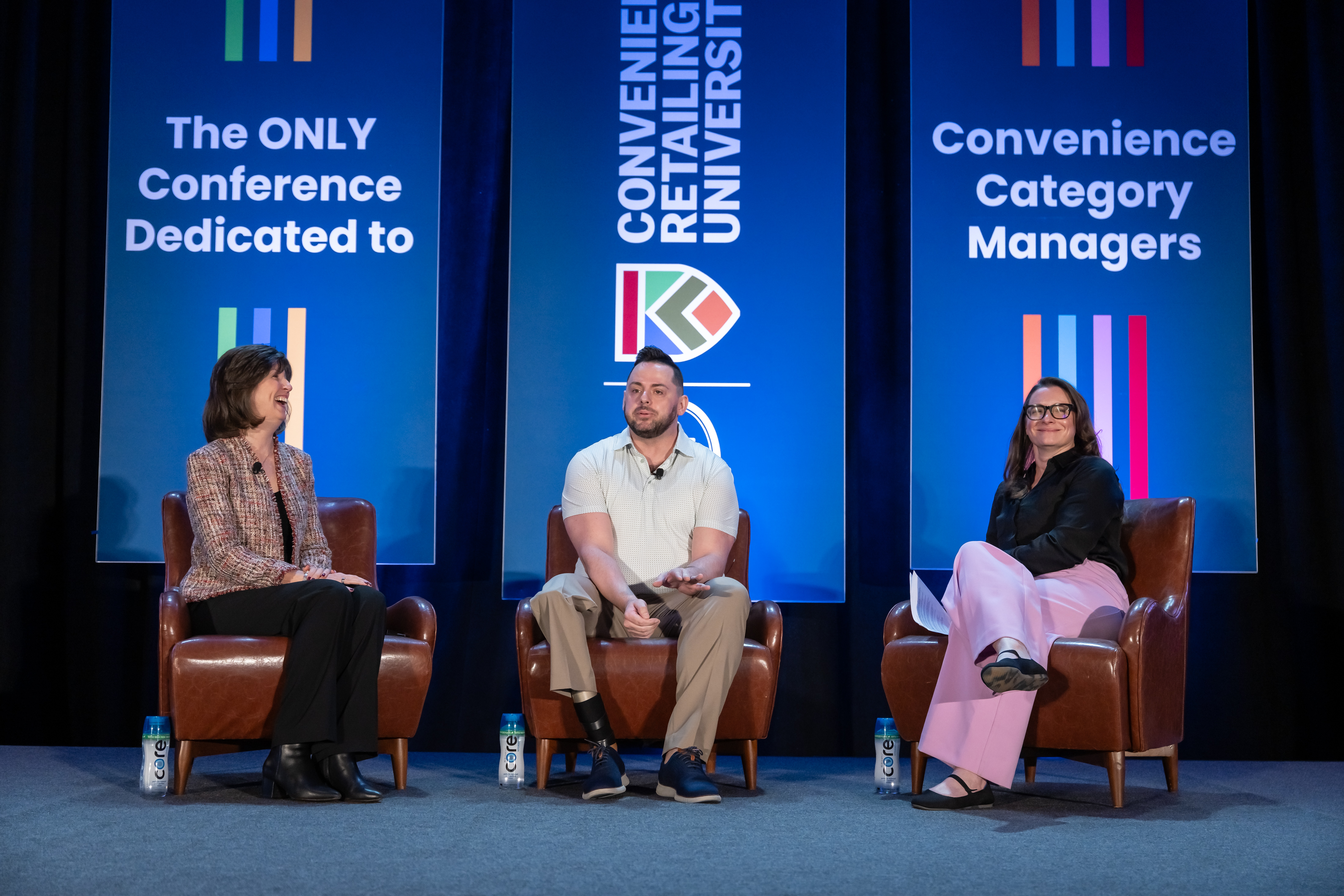 Image of two speakers on the general session stage at the 2024 CRU conference.