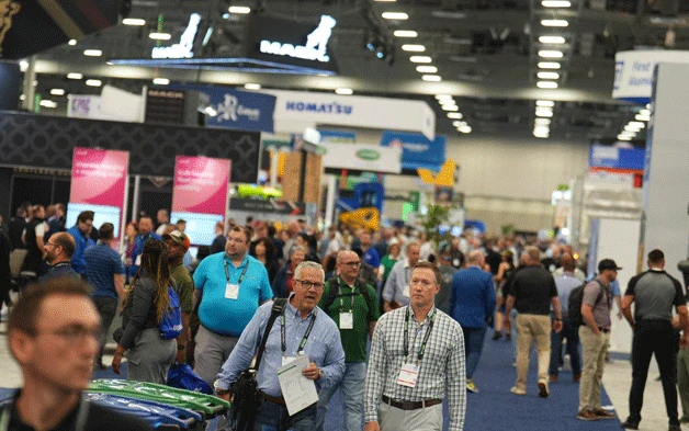 Attendees walking the WasteExpo show floor