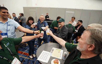 People toasting drinks at the international reception