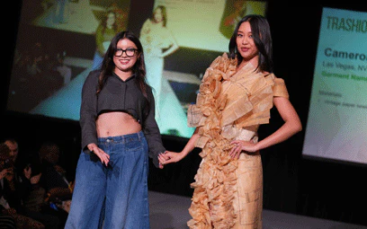 Trashion contestant and designer on the runway