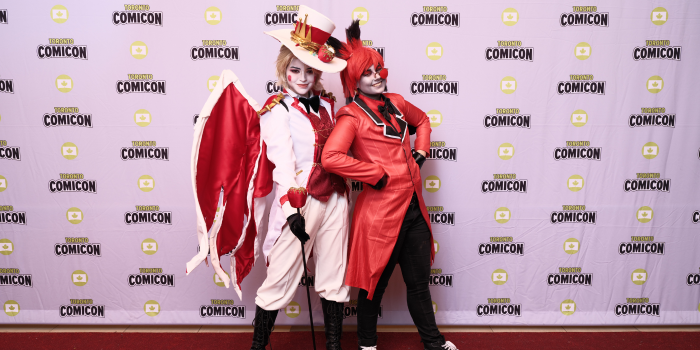 Lucifer and Alister of Helluva Boss strike a pose together on the cosplay red carpet