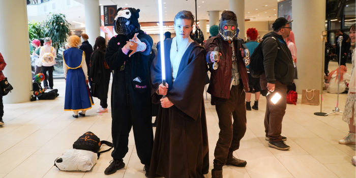From left to right: Spider-Man, dressed in a Kuromi Kigurumi, Obi-Wan Kenobi holding up his saber, and Star Lord, pointing his laser gun at the camera