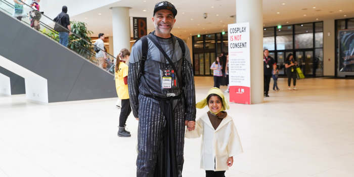 Father daughter cosplay at its finest! Dad, left, is dressed as Darth Vader. Daughter, right, is dressed as a little Grogu
