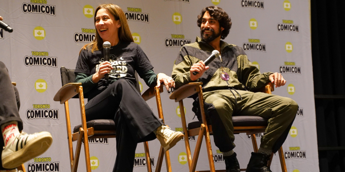 Diana Lee Inosanto and Eman Esfandi from Ahsoka sit side by side, Diana left, Eman right. Both parties smiling widely at the moderator as they listen to the conversation