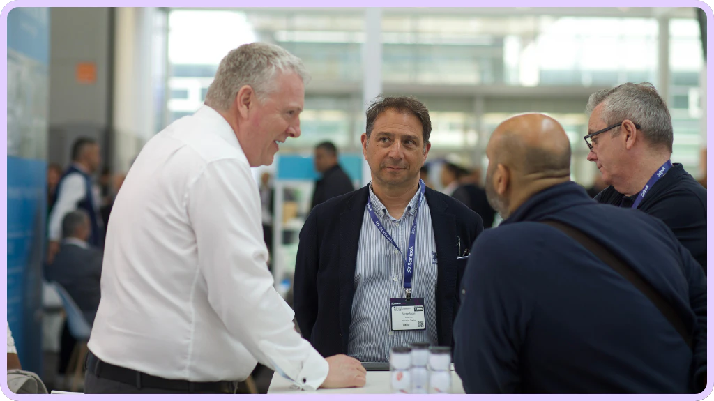 Exhibitors Speaking With Visitors at Tissue World