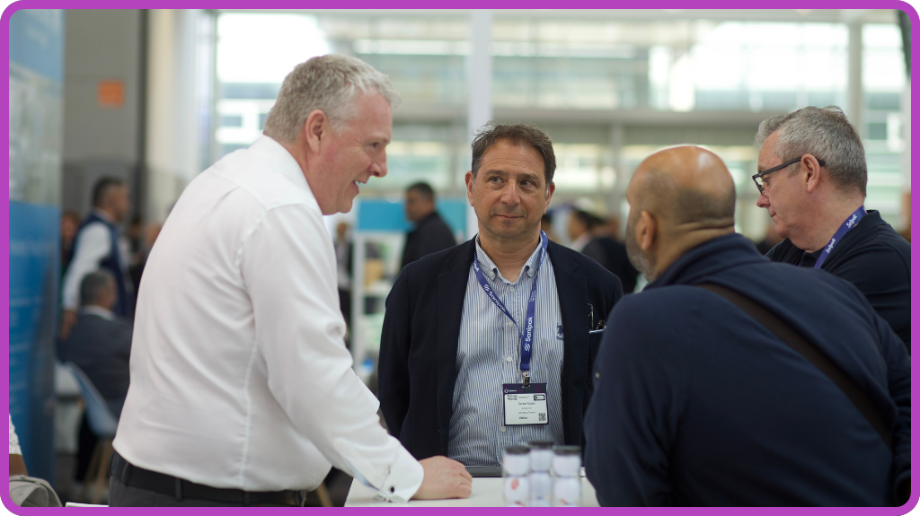 Exhibitors Speaking With Visitors at Tissue World