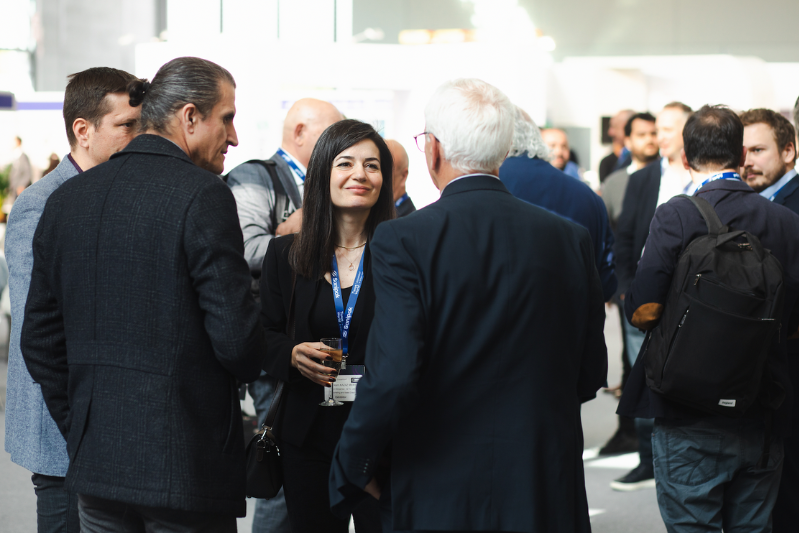 Tissue World Exhibitor shaking hands with visitor