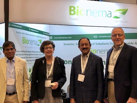 4 people in front of a stand at Biocontrol & Biostimulants LATAM