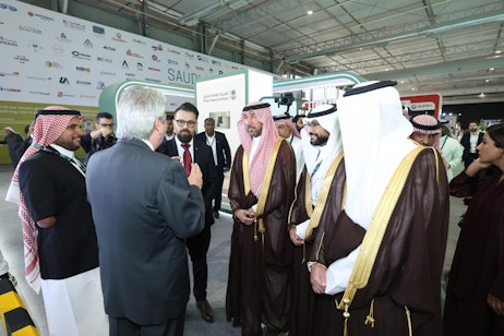 Ministerial guest engaging with attendees during Saudi Intermobility Expo 2024 in Riyadh.