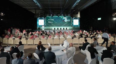 Audience attending plenary session at Saudi Intermobility Expo 2024 focused on Saudi Vision 2030 and mobility innovation.