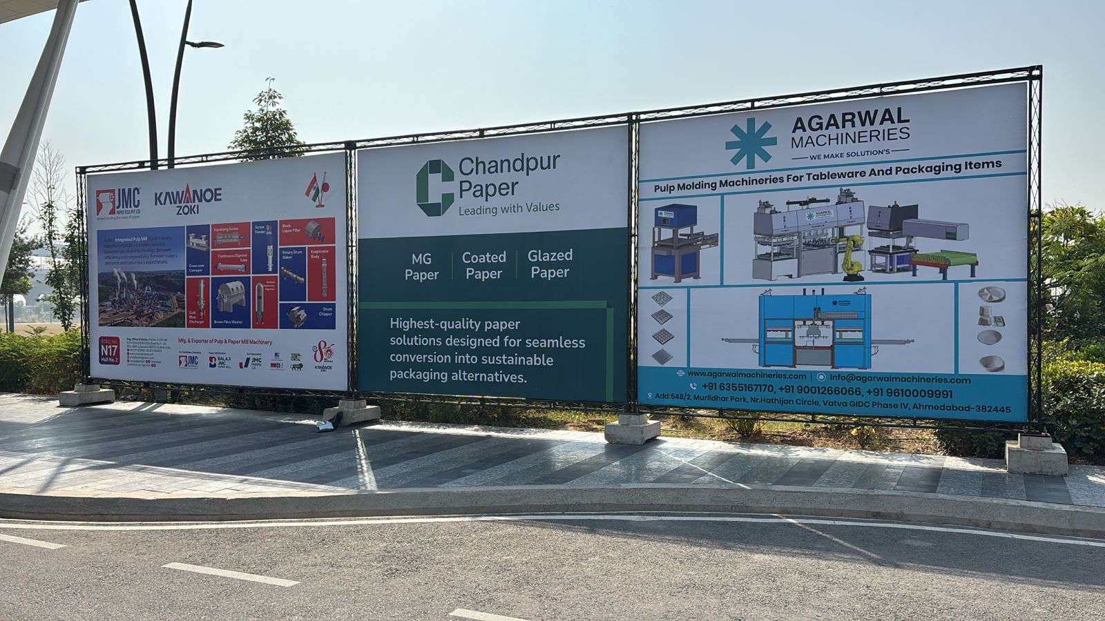 Outdoor billboards installed on the outskirts of the venue featuring event branding and sponsor logos