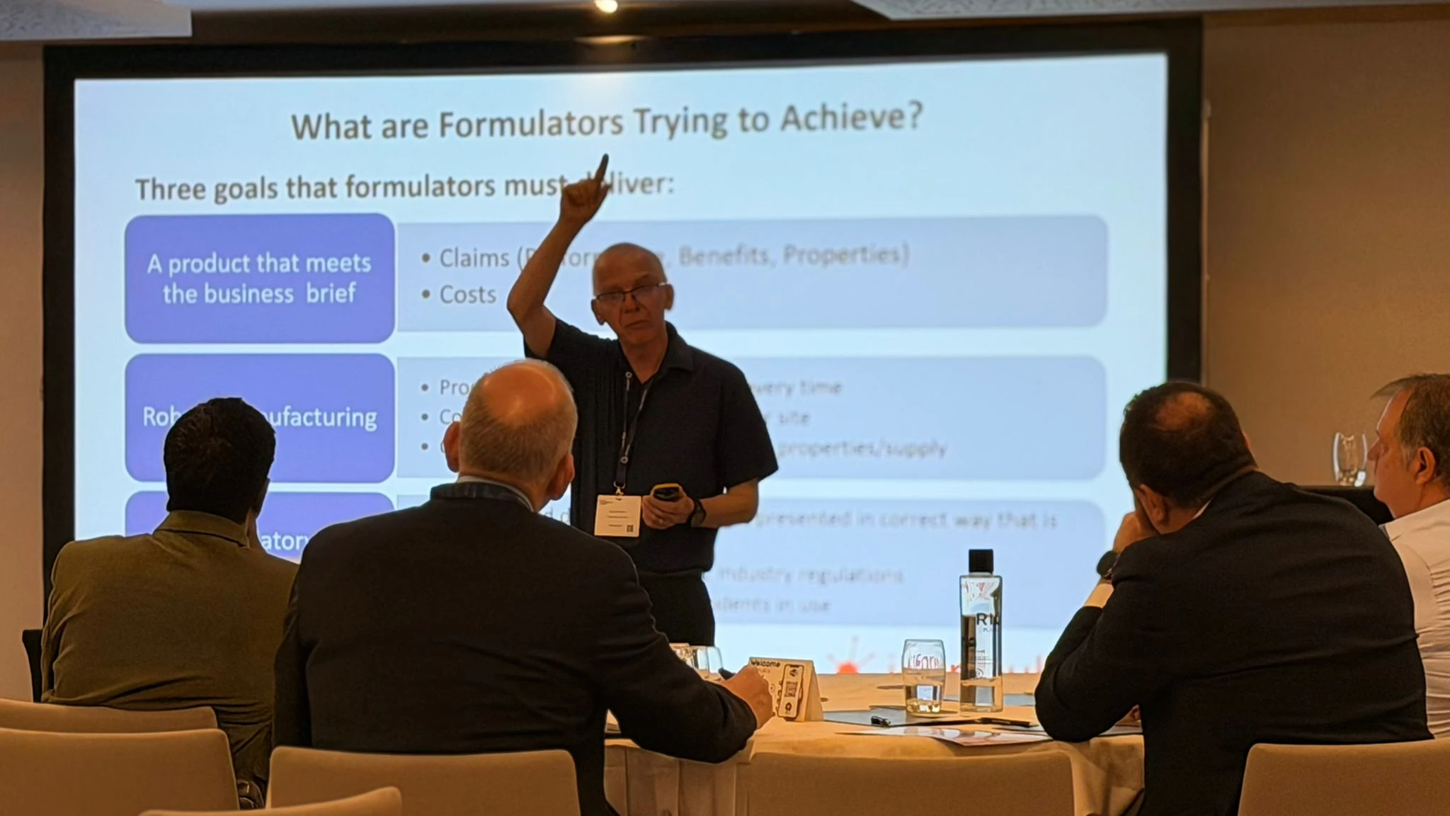 A speaker presents data about the goals that formulators must deliver at the New Ag International Annual