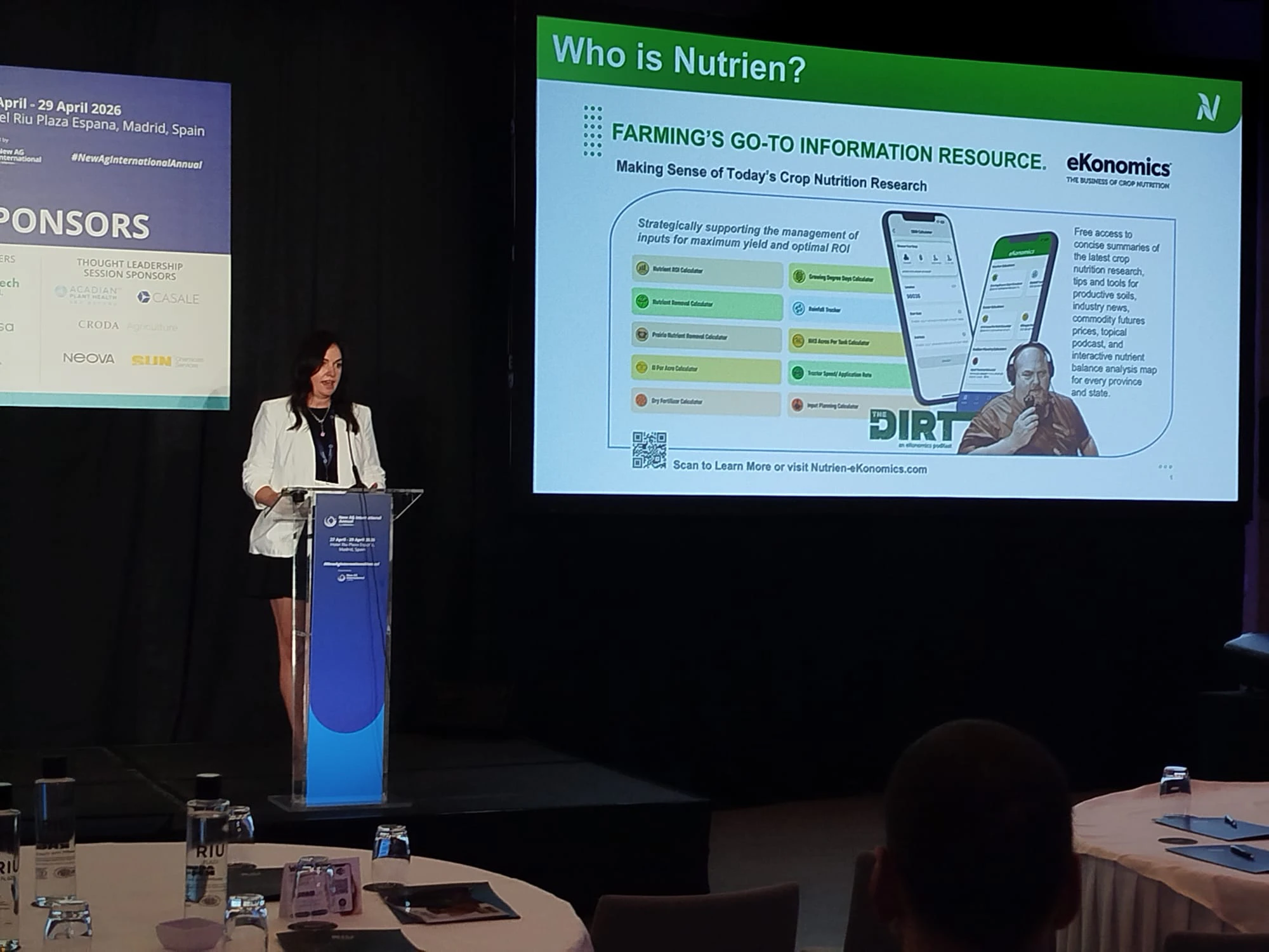 Speaker presents on stage at the New Ag International Annual, discussing innovations in specialty fertilisers and water-soluble solutions.