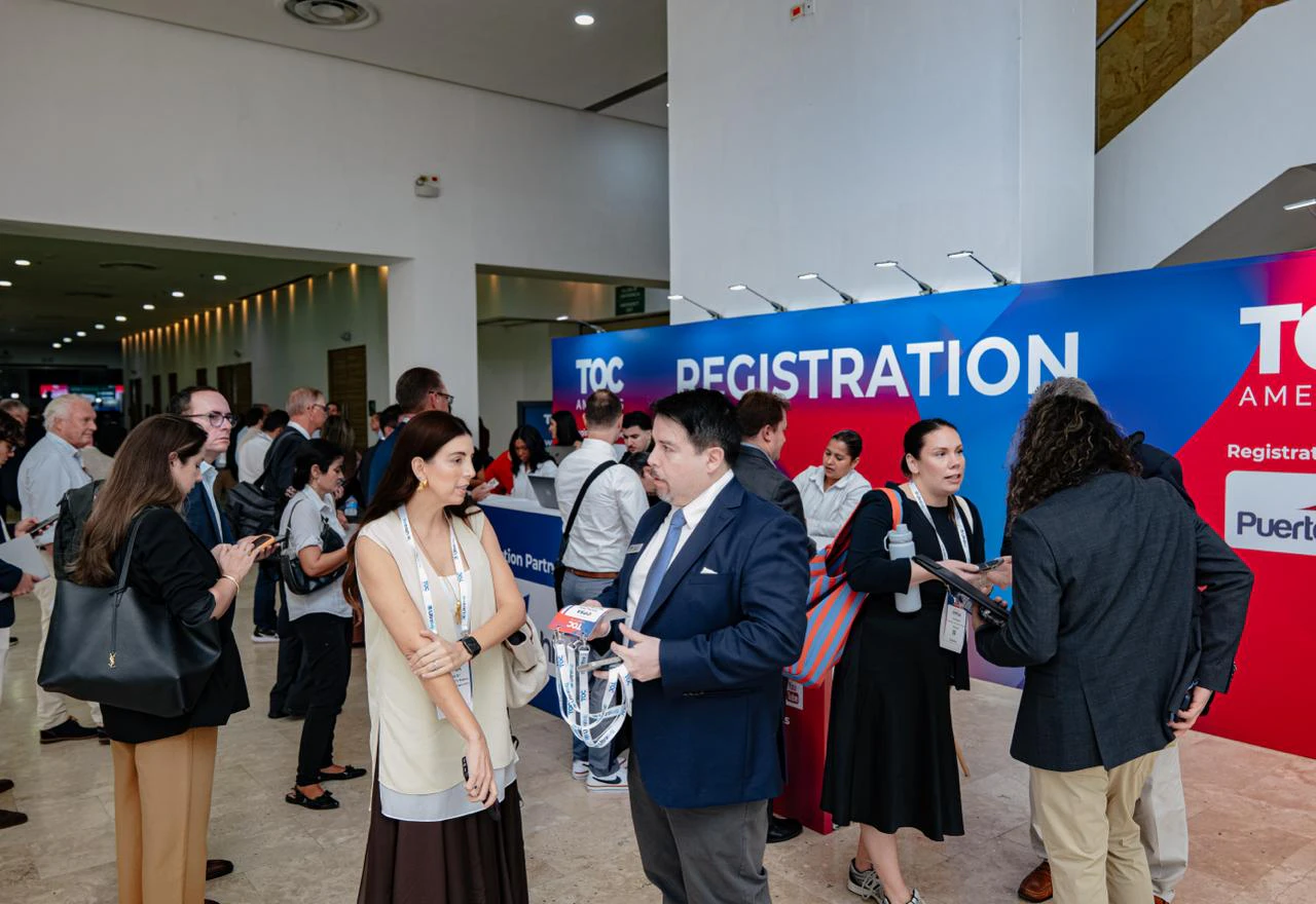 Visitors checking in at the TOC Americas registration desk.