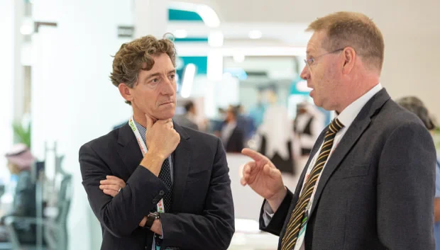 2 businessmen speaking at MEOS GEO 2023