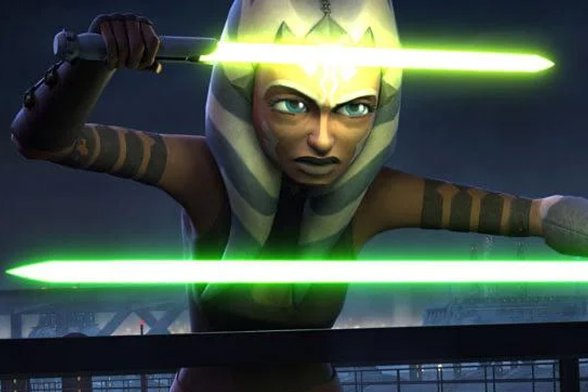 Ahsoka Tano with both lightsabers activated in front of her, with green on the bottom and the yellow/green on the top