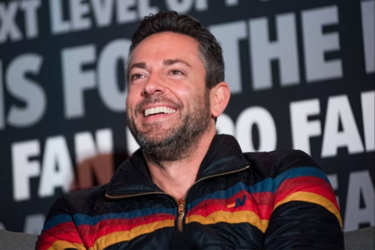 Zachary Levi smiles on stage