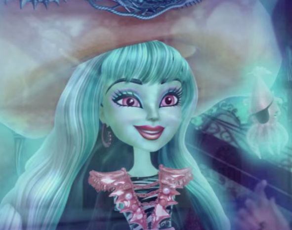 Vandala smiles as her small fish friends swim around her.